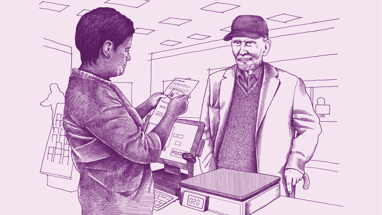 A female, South Asian USPS employee checks the ID card of an older, white man. 
