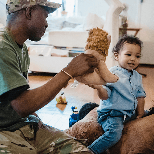 Veteran playing with child