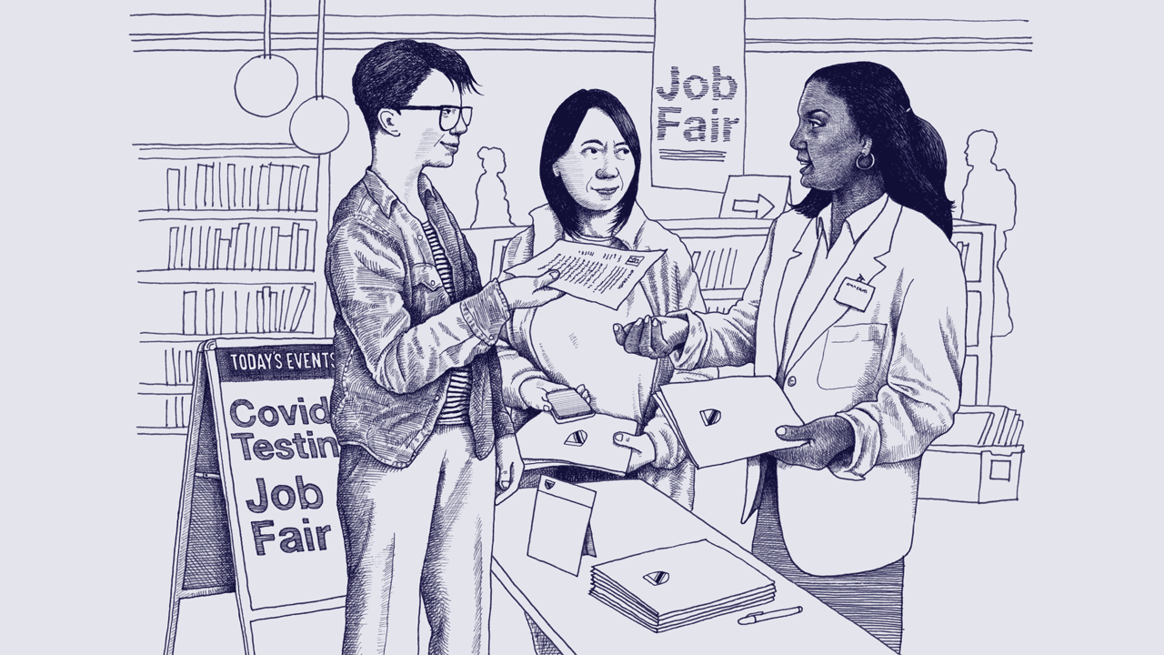 A white nonbinary person hands their resume to a young, Black woman while a middle-aged Asian woman waits in line. They are at a public library that is hosting a job fair.