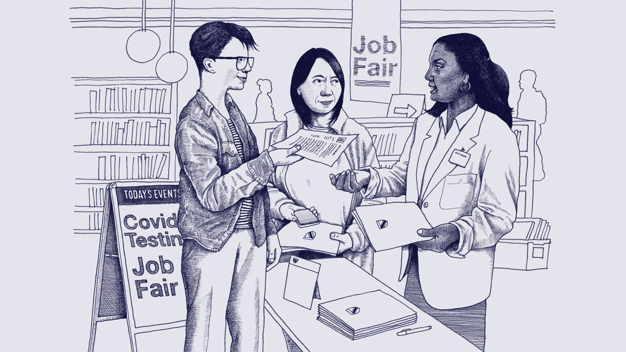 A white nonbinary person hands their resume to a young, Black woman while a middle-aged Asian woman waits in line. They are at a public library that is hosting a job fair. 