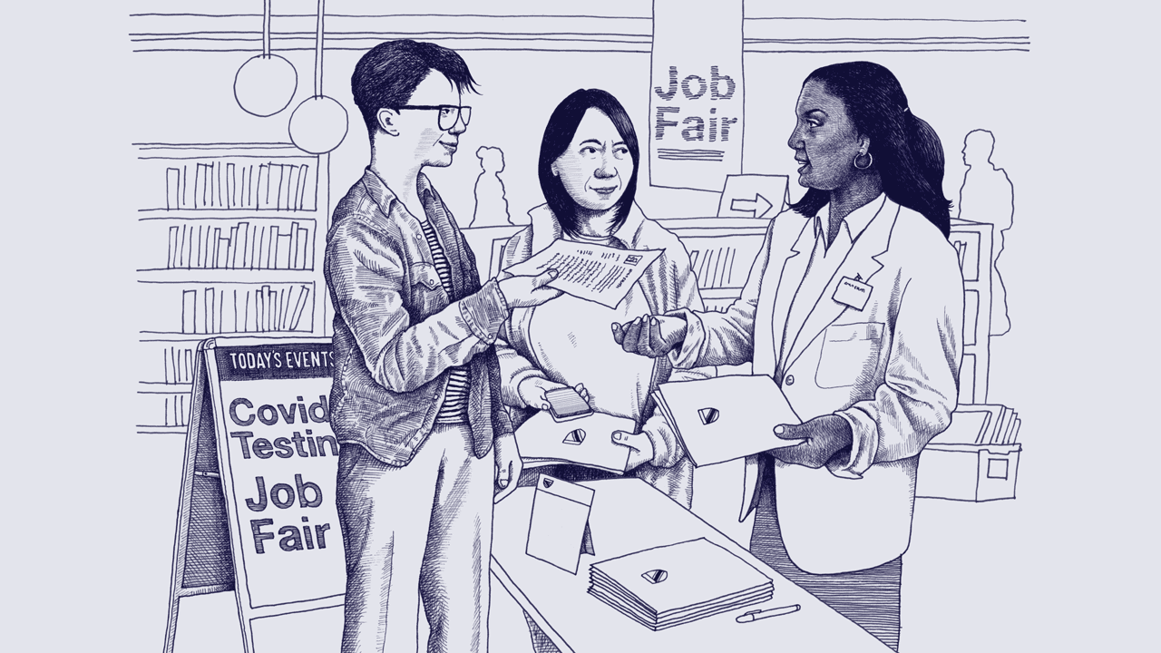 A white nonbinary person hands their resume to a young, Black woman while a middle-aged Asian woman waits in line. They are at a public library that is hosting a job fair.