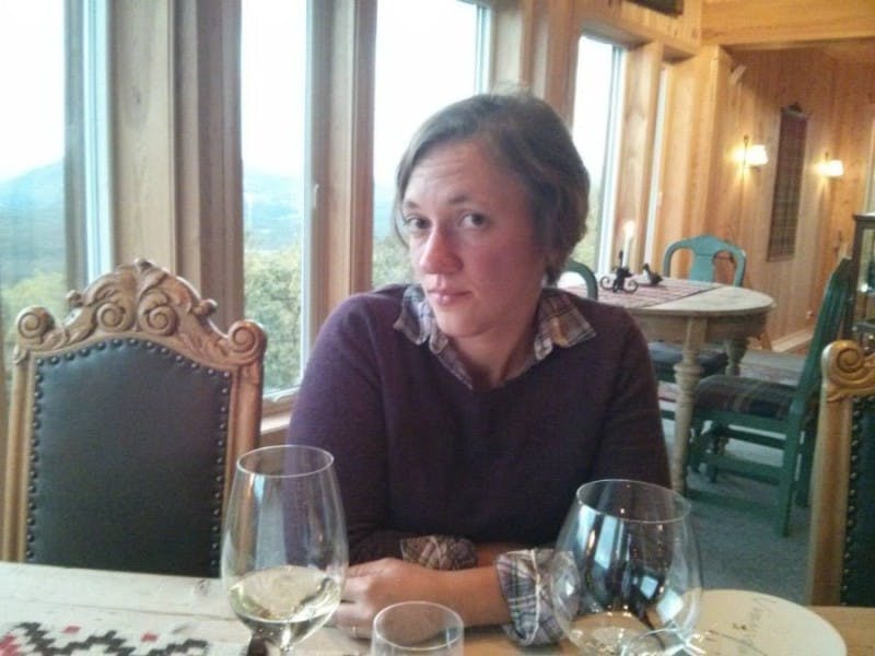 A photo of Amanda Robinson sitting at a restaurant table.